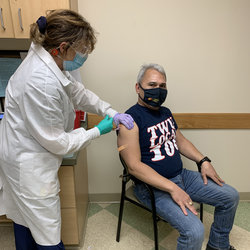 Div Chair Carlos Bernabel receives the vaccine