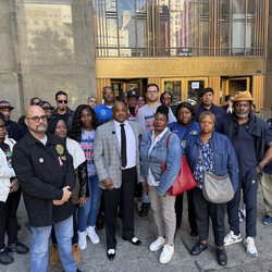 Station VP Kelley outside Manh Criminal Court with assaulted S/A Noreen Mallory and union Brothers and Sisters